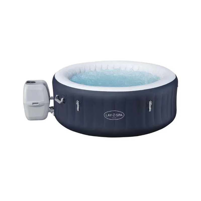 Le spa gonflable rond Bestway Lay-Z-Spa Miami bleu nuit, son bloc pompe blanc accroché sur le côté